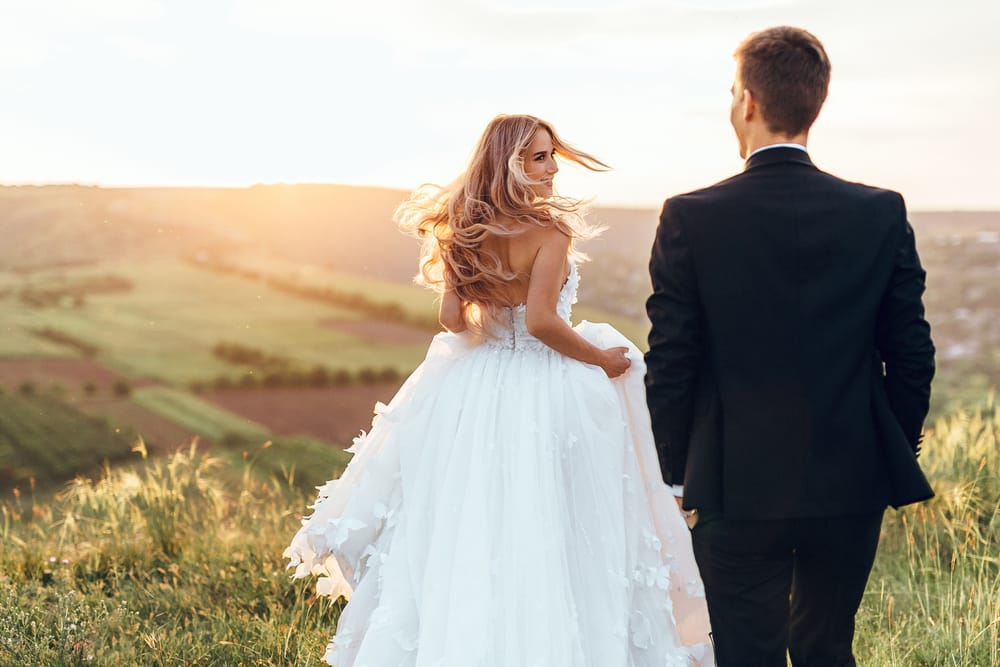 Happy,Young,Bride,Woman,In,White,Dress,Running,In,The